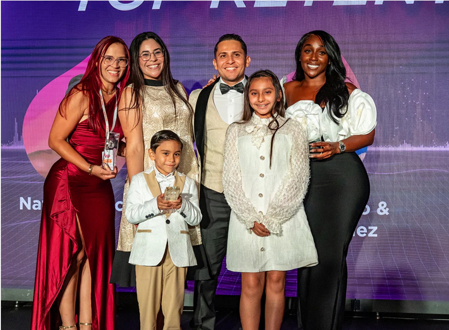 TLC family on stage at an awards event